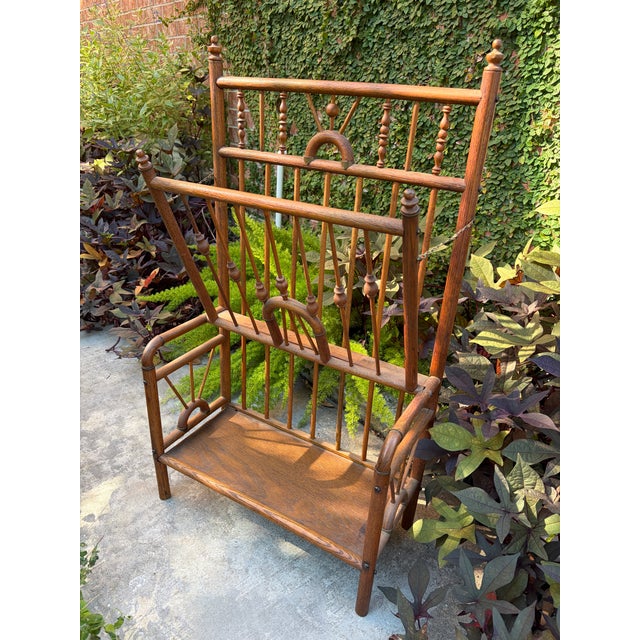 Exceptional antique Victorian stick-and-ball magazine rack dating to the late 19th century. Featuring an elaborate...