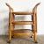 Amazing vintage bohemian three tier bamboo rattan bar cart. Features a natural finish with a lattice panel on the sides.
