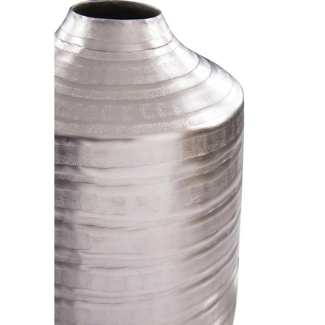 Industrial concrete molds were used as the basis for this new metal texture. Here it is applied to an aluminum cylindrical...