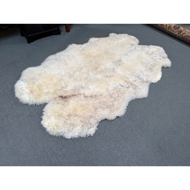 Design Plus Gallery presents Genuine Sheepskin Rug or Throw from Interiors. This sheepskin rug has an ivory tone with...