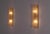 Pair of wall lights each made up of a half-cylinder in thick murano glass with a frosted texture. the glassware is...