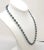 This is part of Chairish’s Costume Jewelry assortment. 1960s goldtone and faceted blue glass beads with goldtone spacer...