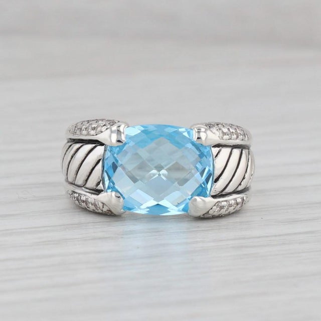Gemstone Information: - Natural Topaz - Carats - 5.86ct Cut - Cushion Color - Light Blue Treatment - Routinely Enhanced -...