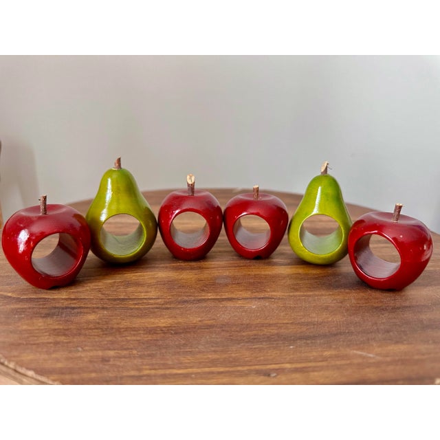 Set of 6 vintage wooden napkin rings. 4 apples and 2 pears with real stems of small twigs. Pears are approximately 2.75”...