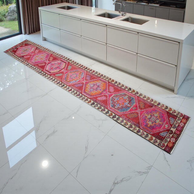 This exceptional 1970s Oushak runner represents the pinnacle of Aegean village weaving, characterized by its saturated...