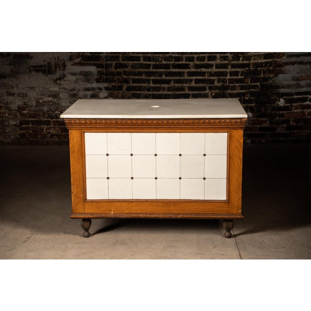 Early 20th century mercantile counter top with milk glass tiles. Bromann Bros., Chicago, IL.