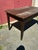 Beautiful dining table in dark oak (very dark brown/black). Features two drawers on one side. Dimensions: 74 x 129 cm....