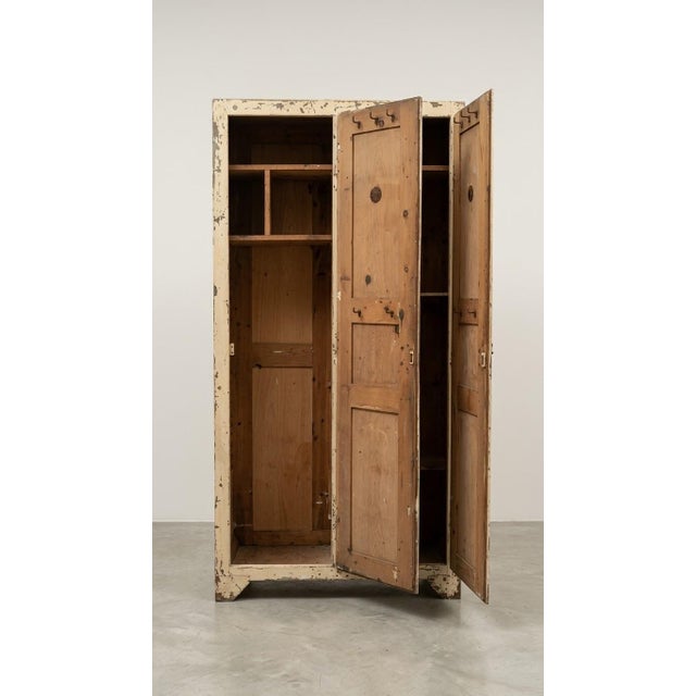 Bring authentic texture and historical depth to your interior with this classic French "Armoire Parisienne." Featuring a...