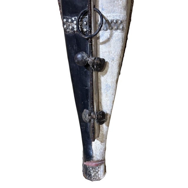 Superb vintage Fang mask carved from a single piece of heavy wood, featuring an elongated heart-shaped face rendered in...
