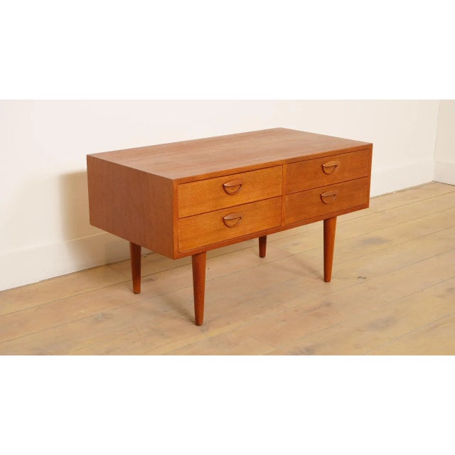 Elegant and compact Danish sideboard/chest of drawers. The clean lines and refined handles on the four drawers show his...
