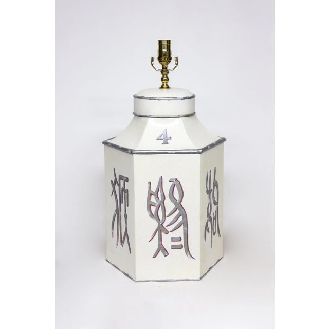 This late 20th-century hand-painted iron table lamp cleverly blends geometric shapes with calligraphic elegance. Based on...