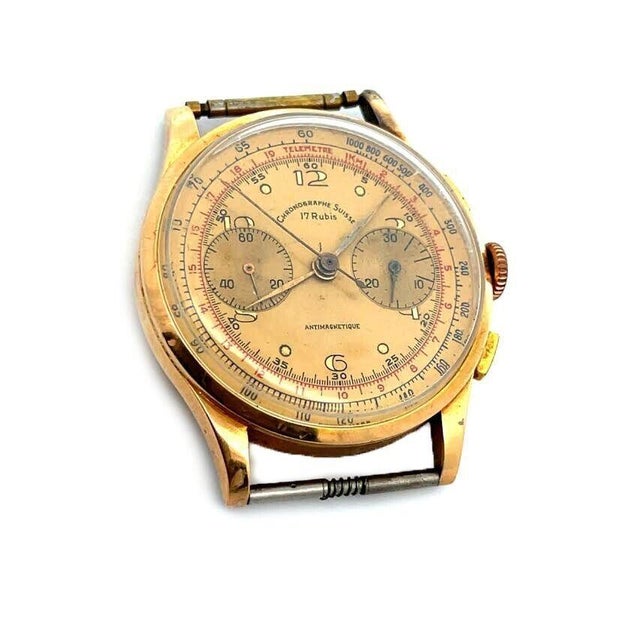 This handsome 1950's watch is crafted from 18k rose gold. The lug pins are included. Chronograph with 2 sub-dials manual...