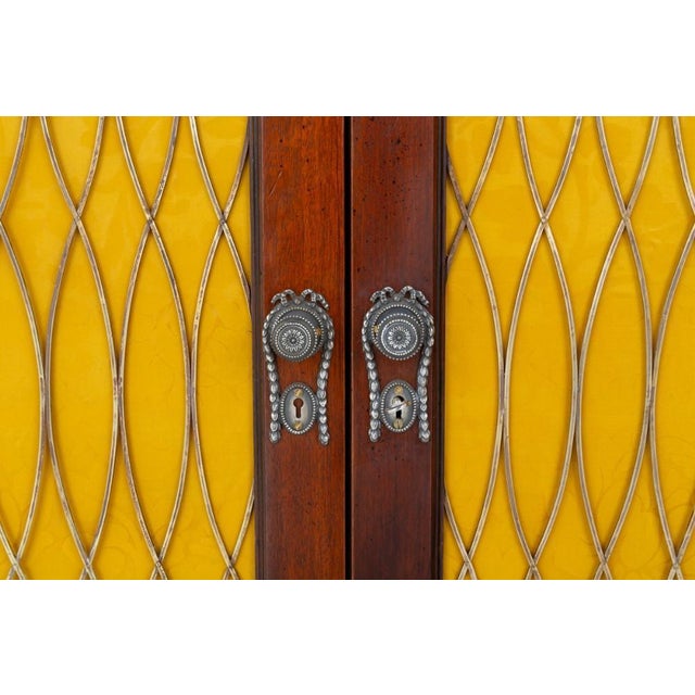 Pair of Regency Revival mahogany side cabinets These cabinets are raised upon a plinth base Circa 1880 The cabinets...