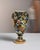 This mid 20th century Mid-Century Modern Vallauris amphora from France is glazed in black and hand-painted with a riot of...