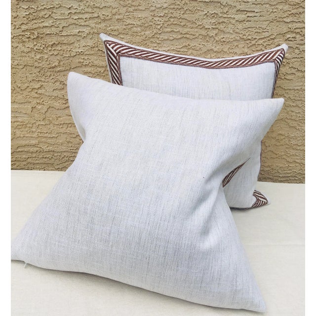 This is a pair of linen And cotton blend tweed pillows with a brocaded brown and cream banded border around all four...