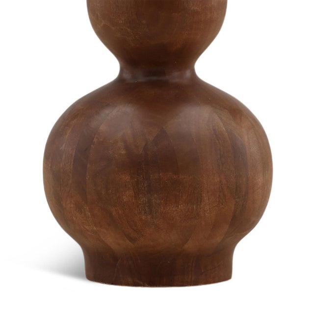 Hand-turned mango wood base floor lamp with classic cotton-linen drum shade. Featuring a striking stacked silhouette of...