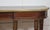 Mahogany long console table, the well-figured mahogany top edged in brass, resting on a moulded frieze and supported by...