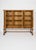Oak Sideboard with Carved Panels and Turned Legs A beautifully detailed vintage oak sideboard distinguished by its carved...