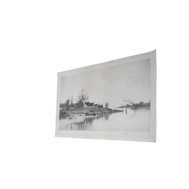 Antique 19th century coastal fishing village etching featuring a calm inlet lined with various boat. Signed lower right....