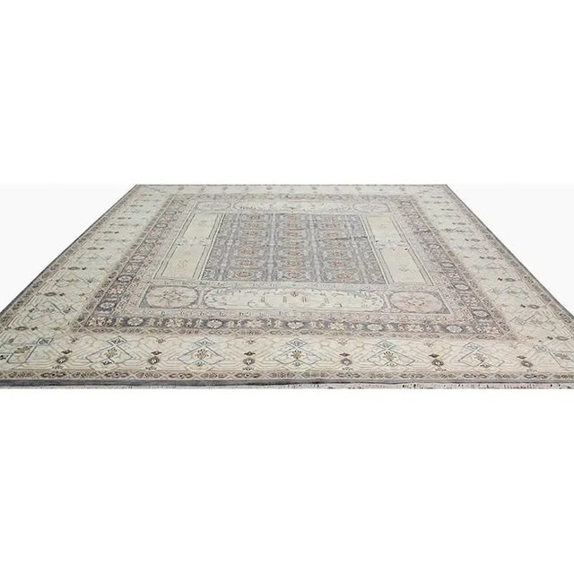 ACTUAL SIZE: 12’1″ x 15’1″ PRIMARY COLOR: Gray / Ivory AGE: New ORIGIN: India MATERIALS: Wool FOUNDATION: Cotton...