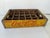 Authentic vintage Coca-Cola wooden bottle crate from the 1960s, featuring its classic bright yellow paint with bold red...