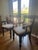 Two elegant armchairs in solid mahogany with a rich espresso finish. Each chair features gracefully turned legs, a classic...