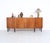 Unique sideboard from denmark produced in the 1950s. the cabinet is veneered with stylish burl wood, creating a warm look...