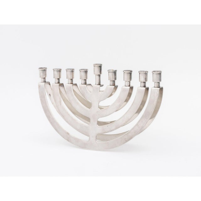 Postmodern Silver Plate Balancing Menorah, apparently unmarked. 6.25" H x 10" W x 2.25" D. Provenance: From a New York...