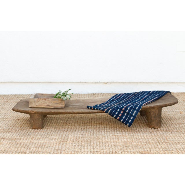 A unique addition to your home, this Senufo coffee table, crafted from a single log of wood. The unique shaped top and...