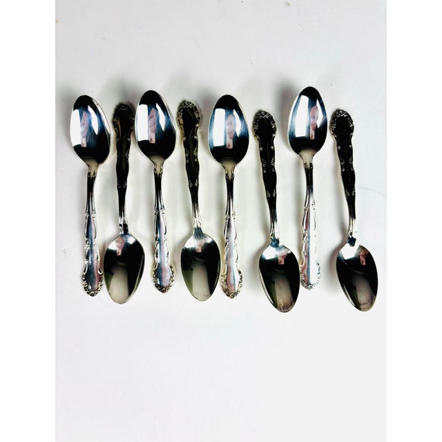 A charming addition to any coffee or tea service, this vintage set of eight Oneida silverplate demitasse spoons showcases...