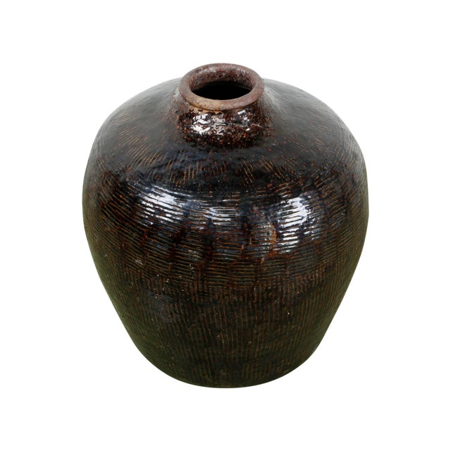 Discover the rustic charm of this Mid-Century Vintage Dark Brown Glazed Porcelain Wine Jar. Each jar, with dimensions of...