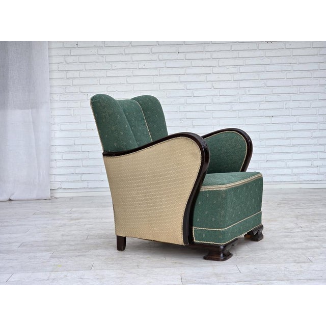 1960s, Danish armchair. Original green and beige furniture wool, dark beech wood, brass springs in the seat. Original good...
