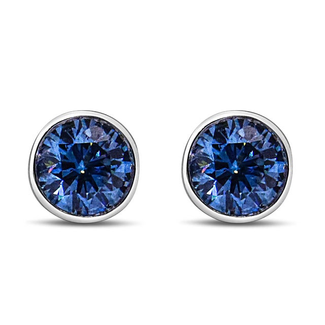 Elegant and timeless, these gorgeous 14K white gold solitaire stud earrings feature bold and beautiful lab grown blue...