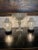 Pair (2) Oriental style white lidded floral open work porcelain vases mounted as lamps. Give off a lovely soft glow when...