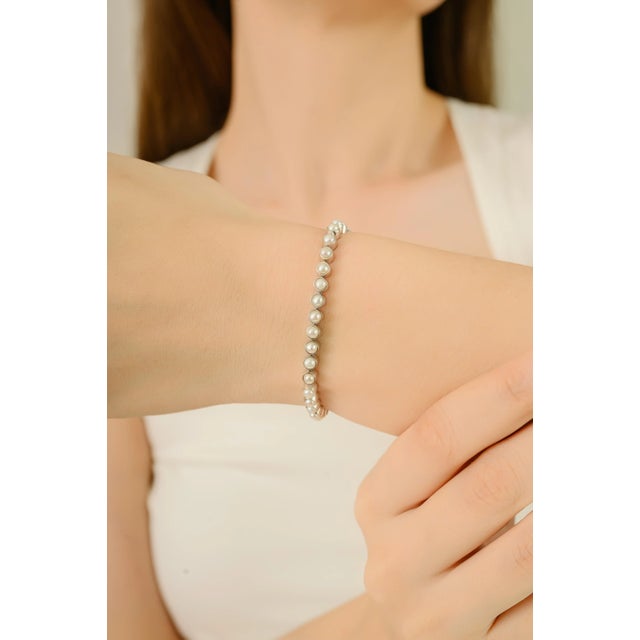 Handcrafted 925 Silver Tennis Bracelet with Natural Pearls, 925 sterling silver bracelet features natural pearls weighing...