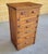 An early 20th-century American Arts & Crafts storage cabinet executed in quarter-sawn oak with warm original patina and...