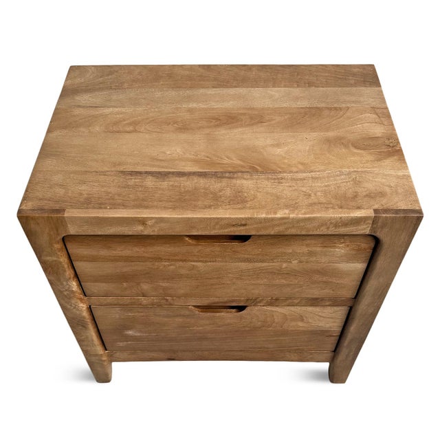 Contemporary natural solid mango wood nightstand. Clean lines and modern simple style featuring two drawers with cutout...