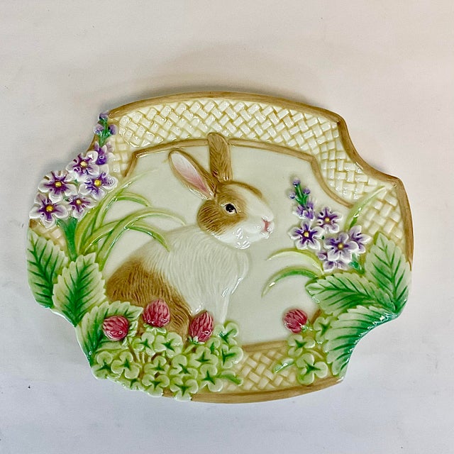 This is a whimsical Bunny Decorative Plate from Fitz and Floyd. It features a bunny surrounded by spring berries, flowers...