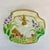 This is a whimsical Bunny Decorative Plate from Fitz and Floyd. It features a bunny surrounded by spring berries, flowers...