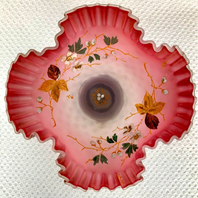 Charming Victorian Centerpiece with a Cranberry Pink Ruffled Opaque Glass Bowl and Hand Painted Flowers, The Bowl is...