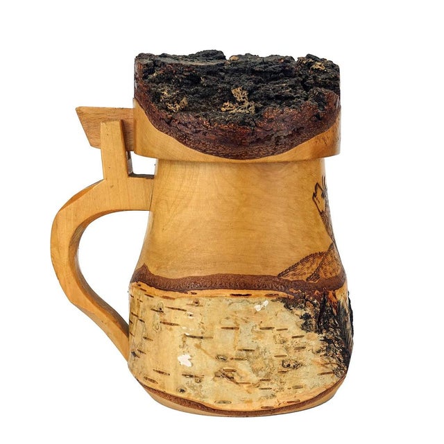 Large wooden beer mug made of carved birch and bark with deer motif, Black Forest, 1960s. The item is actually intended...