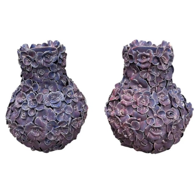 This striking pair of vintage ceramic vases showcases exquisite Italian craftsmanship and bold botanical artistry. Crafted...