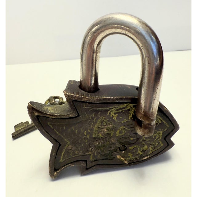 This old antique fish lock measures 3 1/2" H X 3 3/4" W inches and has beautiful patina due to its age. Fishes are...