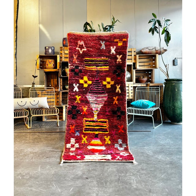 This Moroccan Boujad runner rug is a vivid and expressive example of Berber weaving from the Boujad region. Handwoven in...
