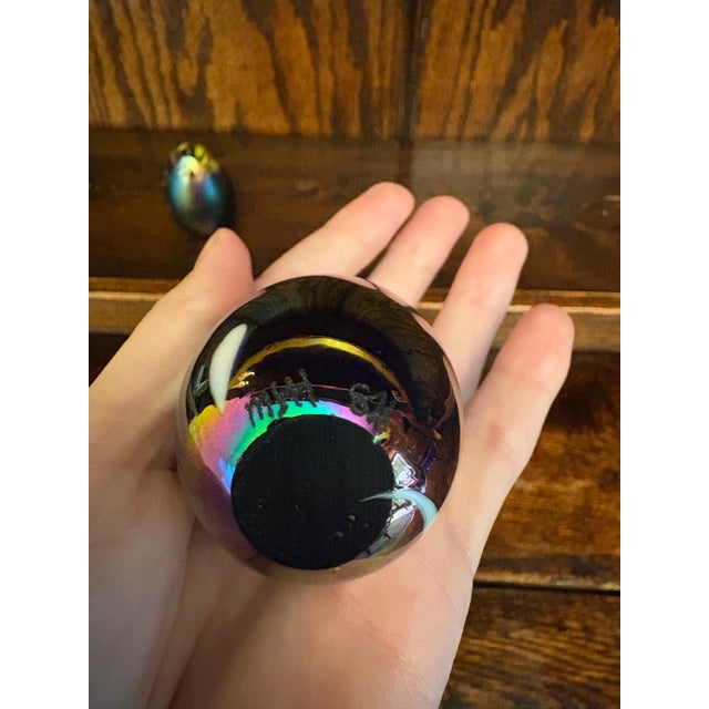 This listing features a pair of early 1980s studio art glass paperweights, associated with the Pacific Northwest studio...