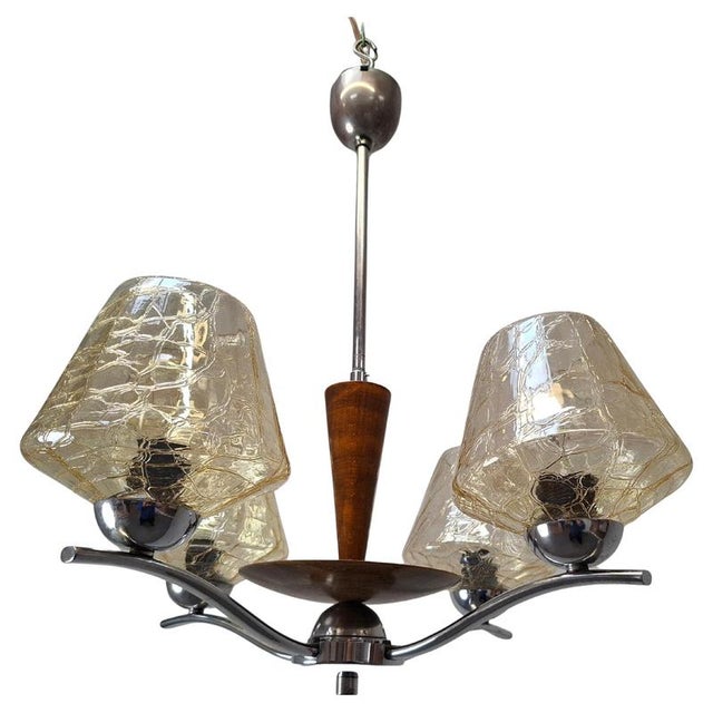 Mid-century modern four-arm chandelier manufactured by napako in former czechoslovakia during the 1960s. This elegant...
