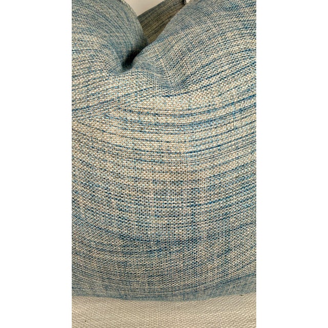 Custom pair of 22" pillows covered in Fermoie "Wave" in color 006. These pillows are self welted, have tapered corners to...