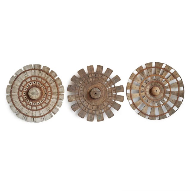 Vintage wood sewing wheel from India. Each is hand crafted is unique in signs of age and use, wood tones, and other...