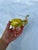 This listing is for a mid-century vintage, hand-blown Murano glass elephant figurine. Yellow with green accents.