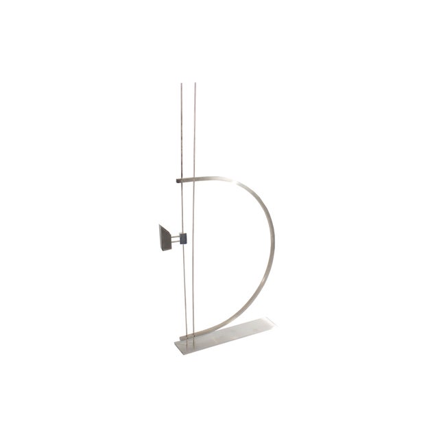 A Postmodern metal candlestick holder designed by the American designer David Zelman (born 1945) for his company Prologue...